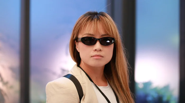 A person wearing the Meta Starfire AI glasses