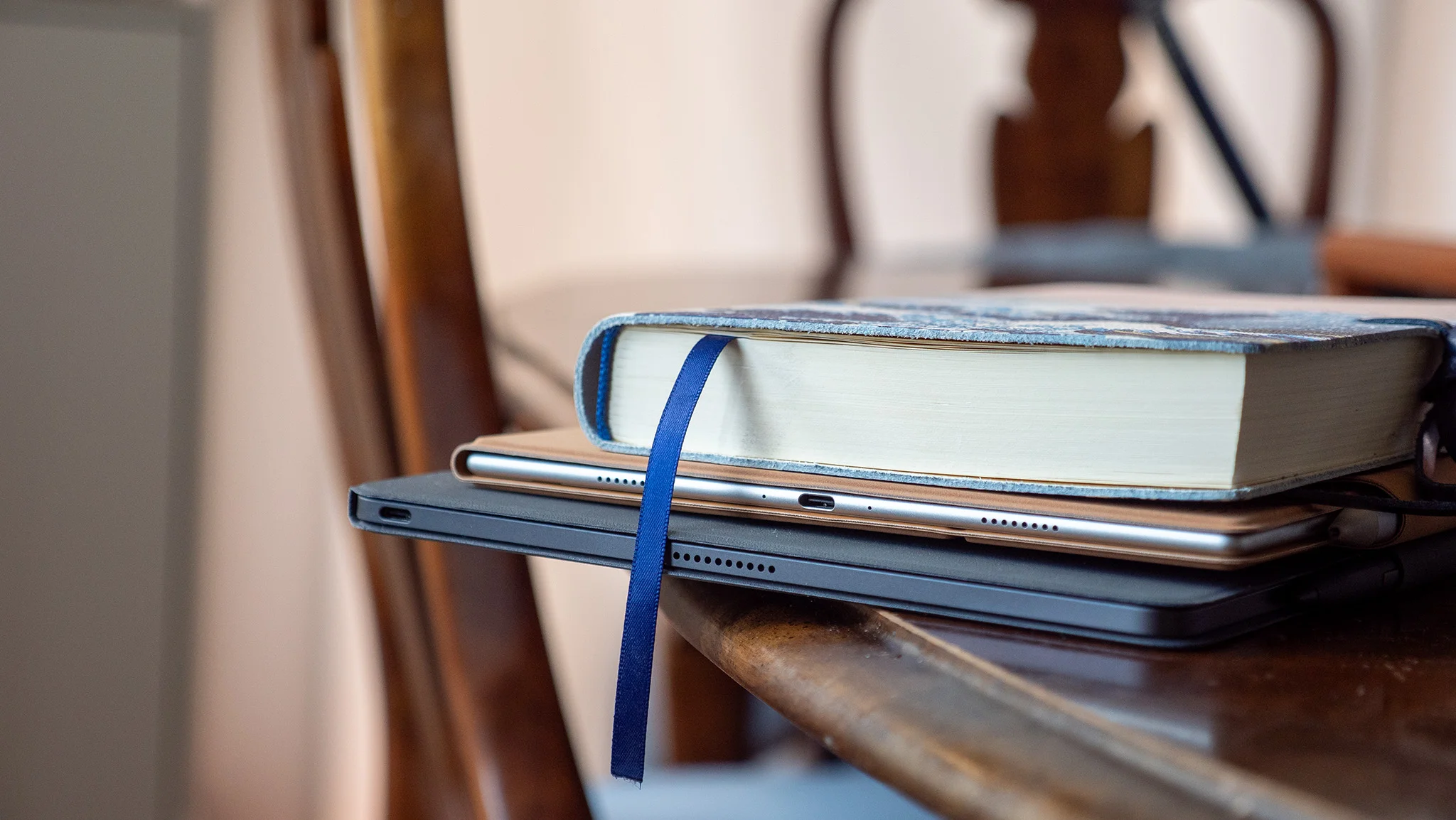 A notebook on top of a Boox Go 10.3 Gen II and a TCL Note A1 NXTPAPER