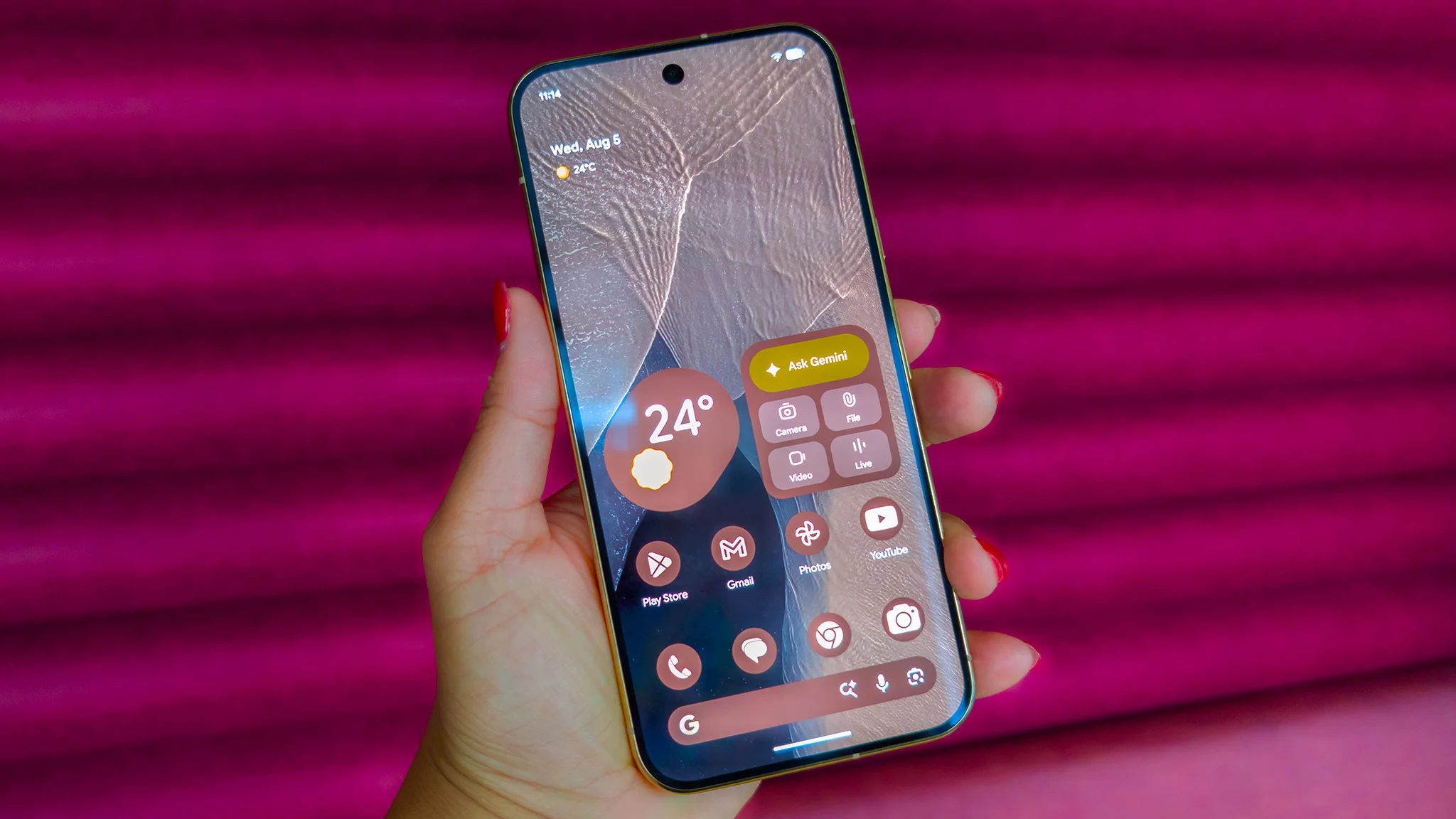 The themed home screen of the pink Google Pixel 11 Pro XL