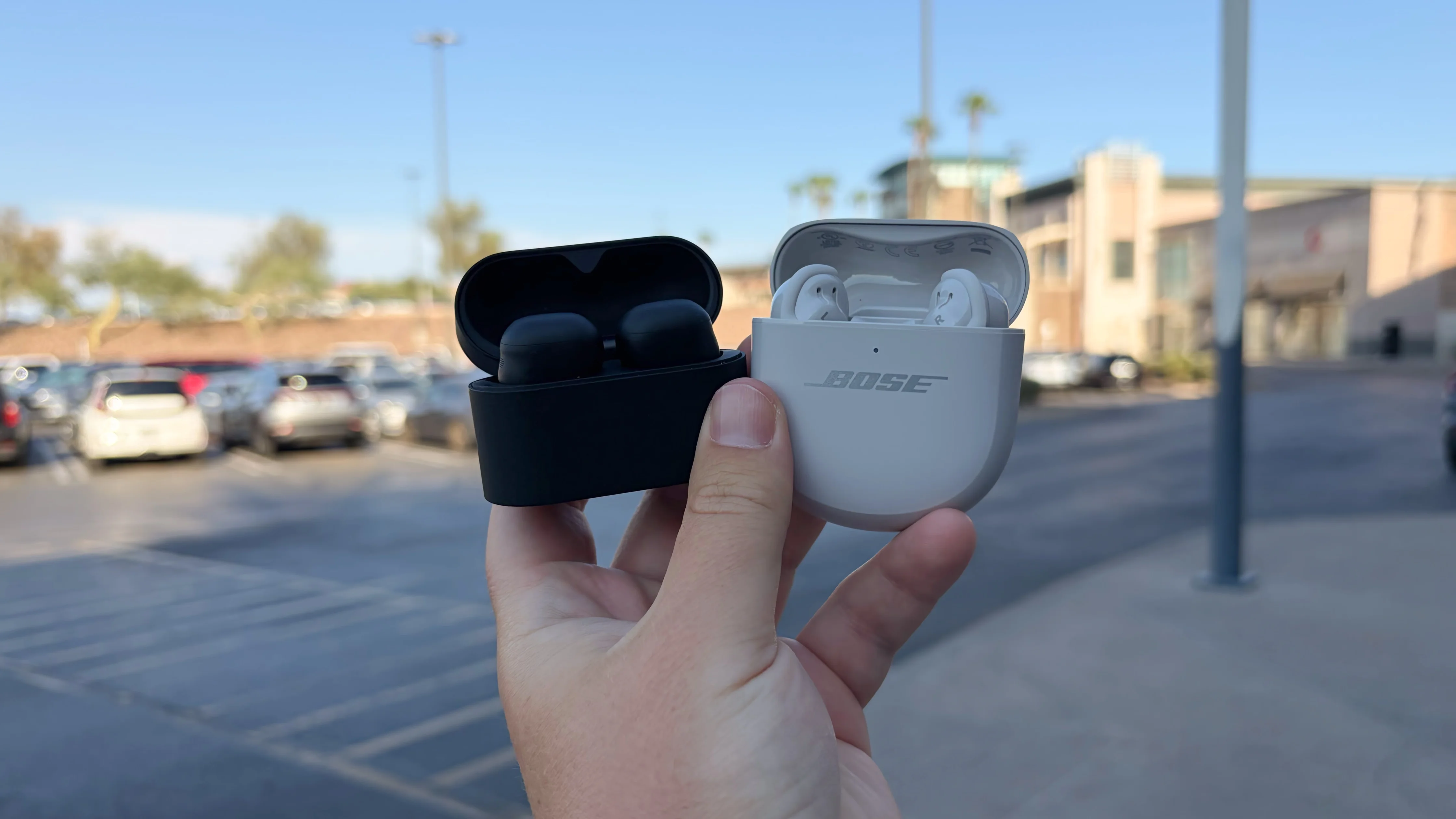 The Sony WF-1000XM6 and the Bose QuietComfort Ultra Earbuds at a mall.