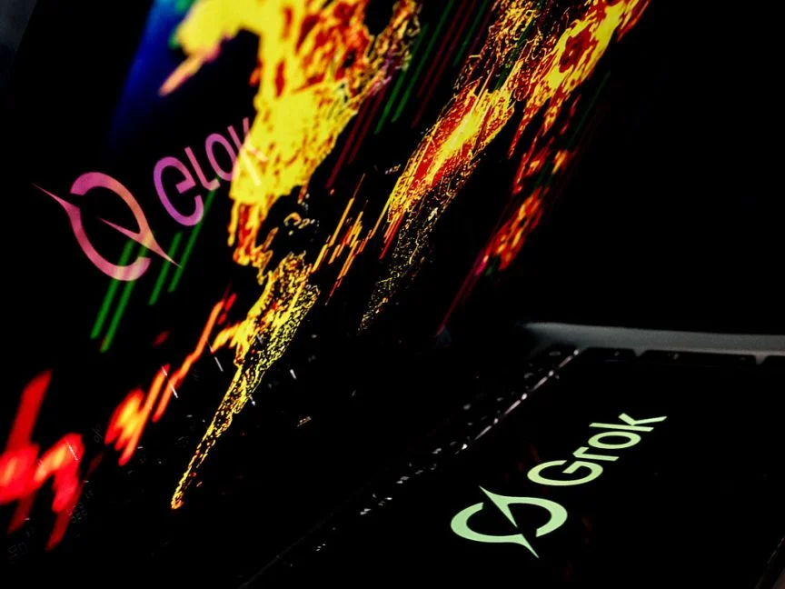 The Grok logo projected below a map of the world