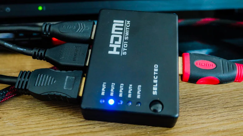 An HDMI switch on a TV stand.