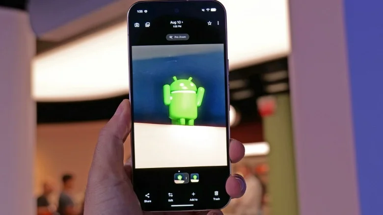 Google Pixel 11 with an Android mascot on the display.