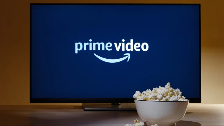 Prime Video logo on a TV, with a bowl of popcorn in front of it