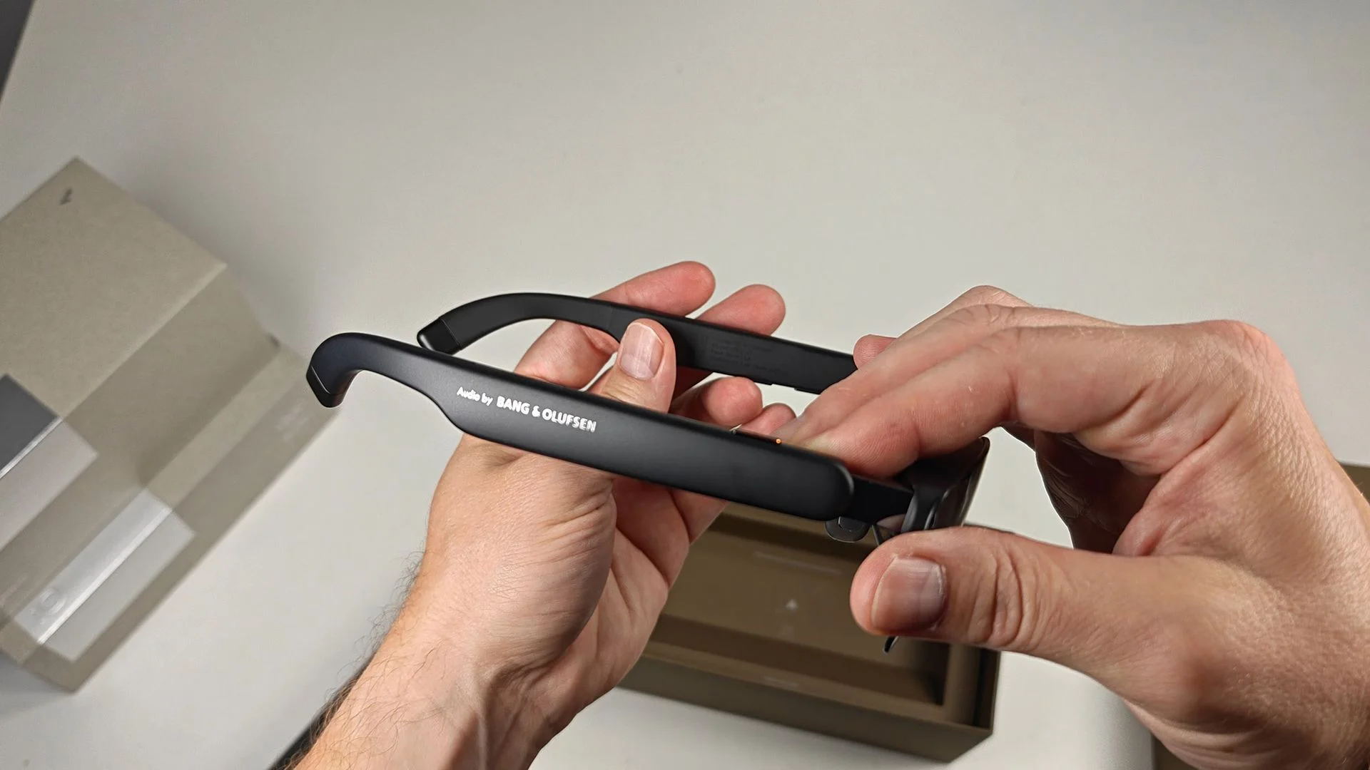 The Bang & Olufsen logo on the side of RayNeo GT smart glasses