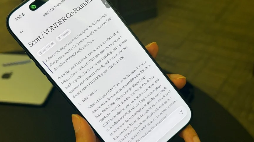 A phone screen showing an AI summary about Scott Stein