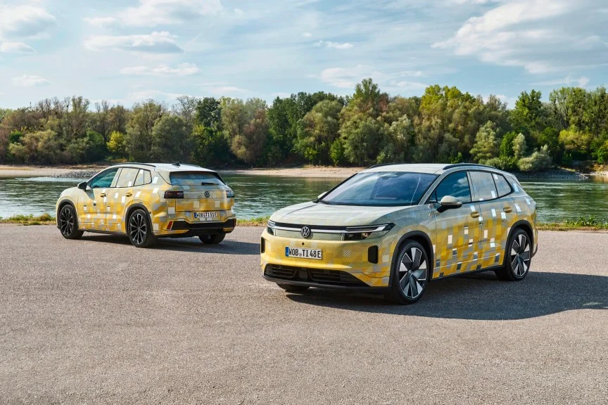 Two variants of the upcoming VW ID Tiguan, parked and camouflage wrapped