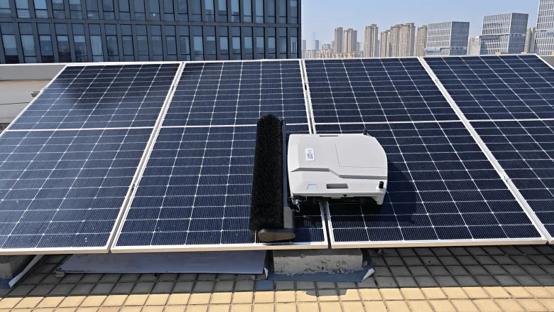 A Skysys solar-cleaning robot operates on rooftop photovoltaic panels. | IMAGE CREDIT: Skysys